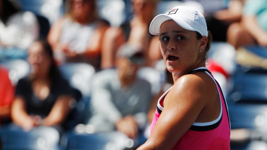 Ashleigh Barty looks back over her shoulder with a disappointed expression on her face