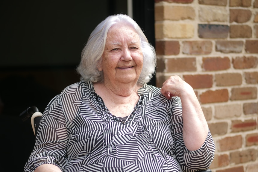 Woman in wheelchair smiles