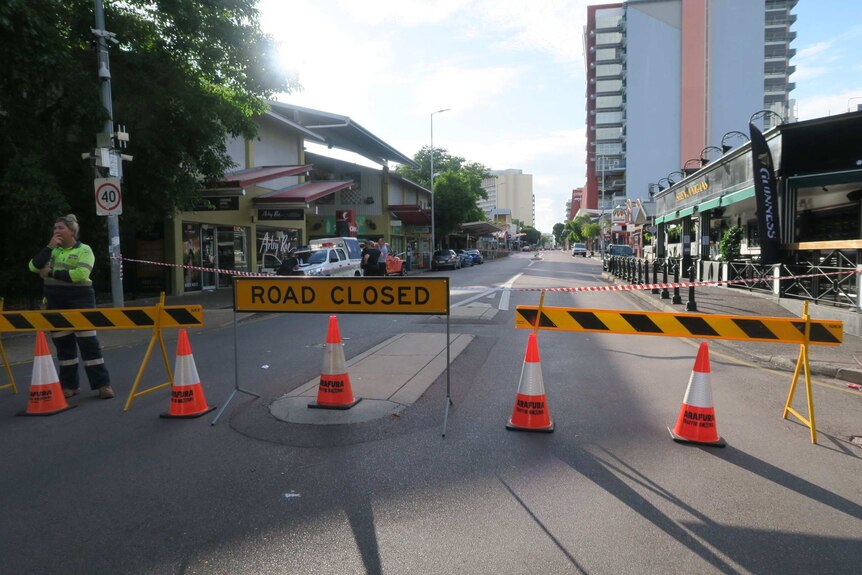 Road closure signs, witches hats and barricades stand on Mitchell St.