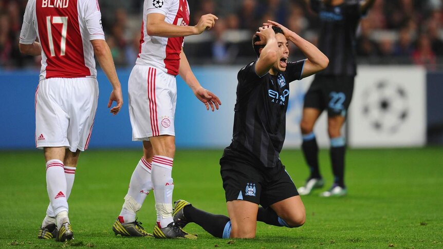 Sami Nasri pleads for a penalty as City falls in Amsterdam.