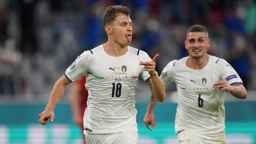 Nicolo Barella runs wagging his finger with his tongue out