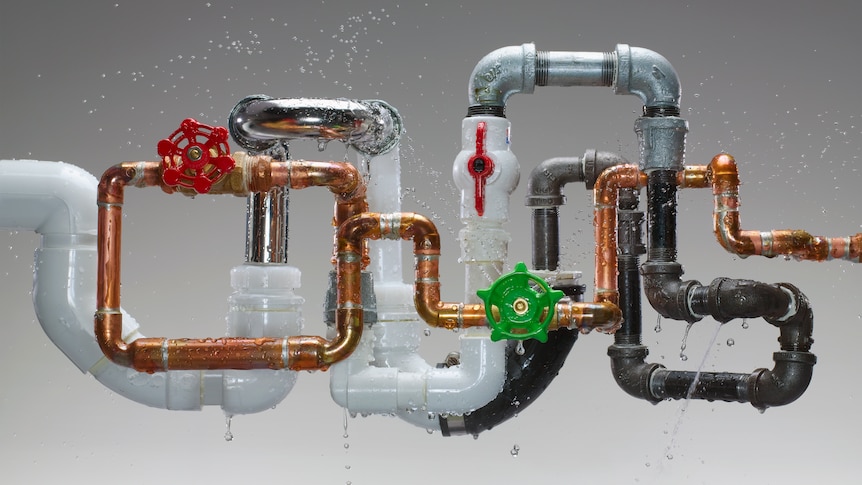 A set of multi-coloured pipes leaking water