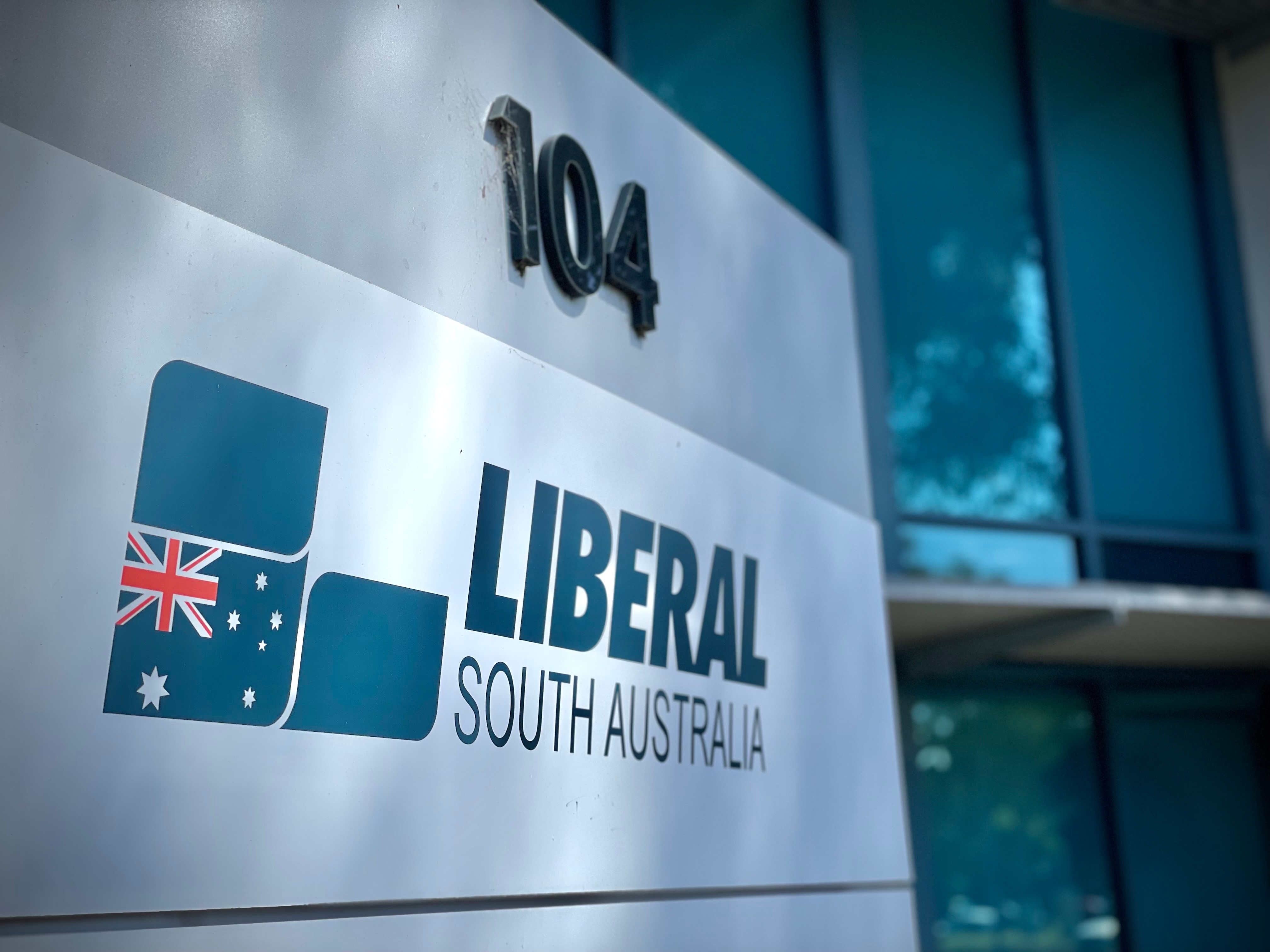 A sign reading Liberal South Australia in front of a building