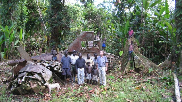 Visitors stand in front of the Yamamoto crash site in PNG's Bougainville region