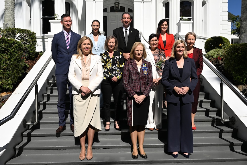 state politicians lined up on the steps of parliament