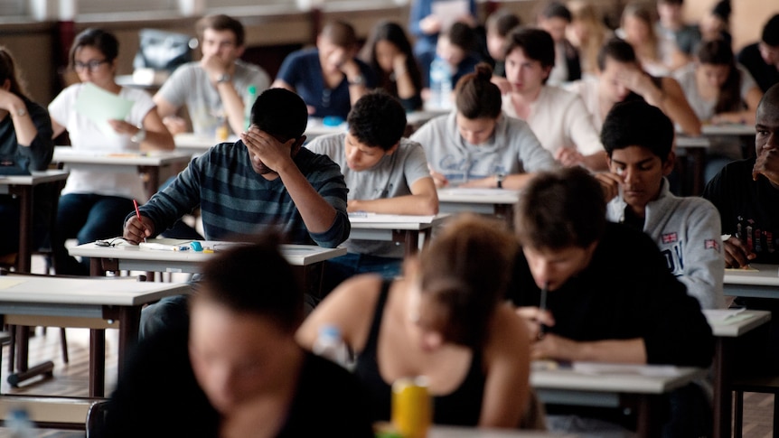 Students sit an exam