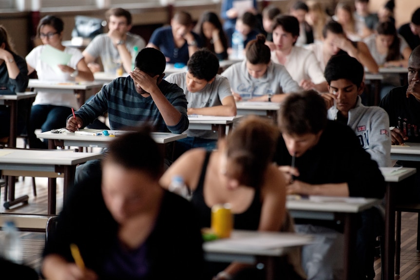 Students sit an exam