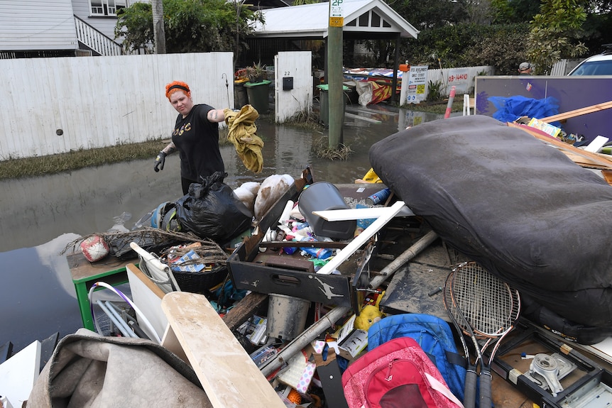 Jazmin Chartres cleans up her flood-damaged house