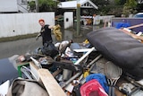 Jazmin Chartres cleans up her flood-damaged house