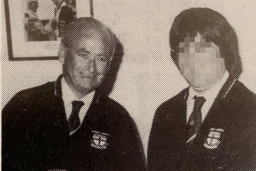 Albert Briggs and another man pose for a photo with their timekeeping clocks.