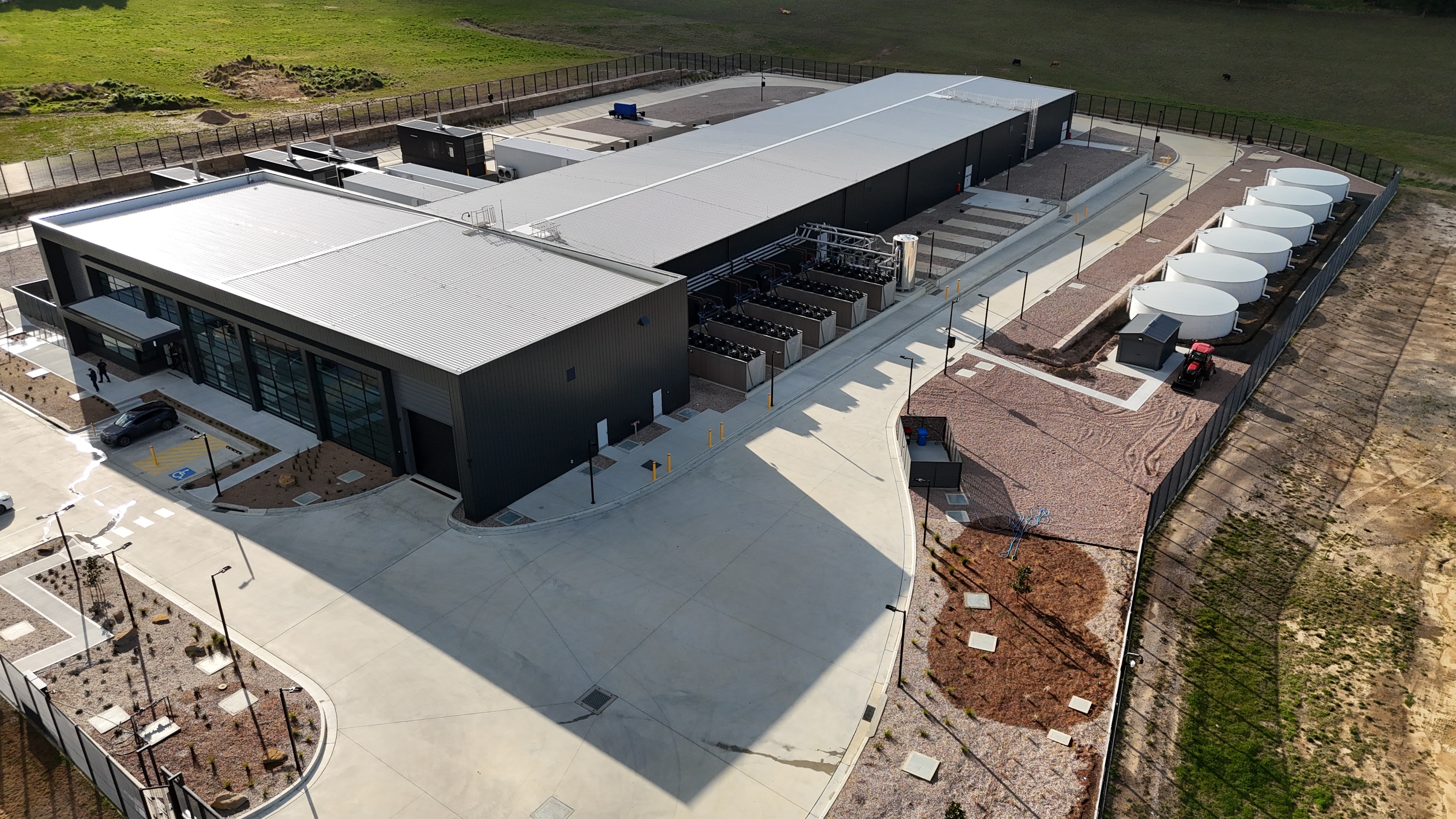 image of black building with water tanks and infrastructure
