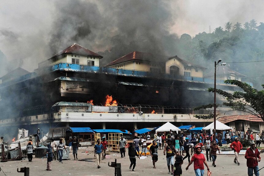 Local market is seen burning during a protest in Fakfak, Papua province,