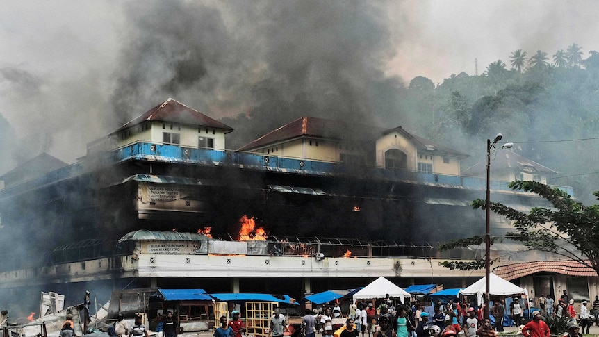 Local market is seen burning during a protest in Fakfak, Papua province,