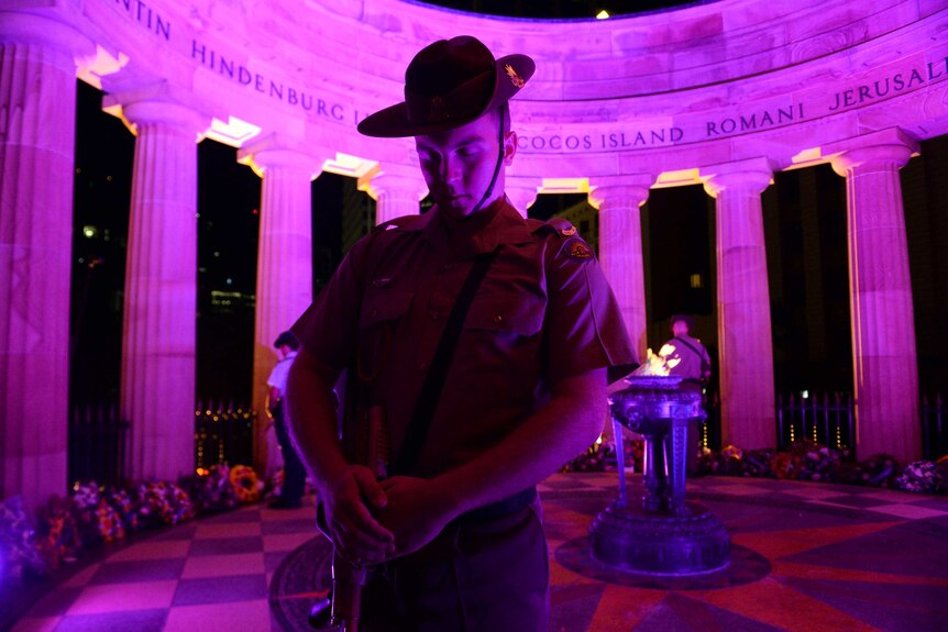 A soldier stands guard during an Anzac Day dawn service at the Cenotaph in Brisbane.