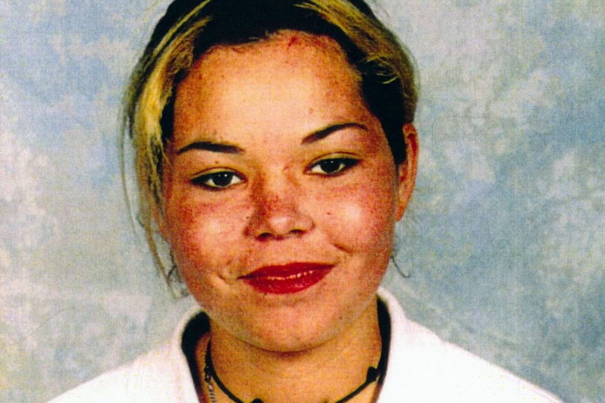 A school photo of a smiling teenage girl.