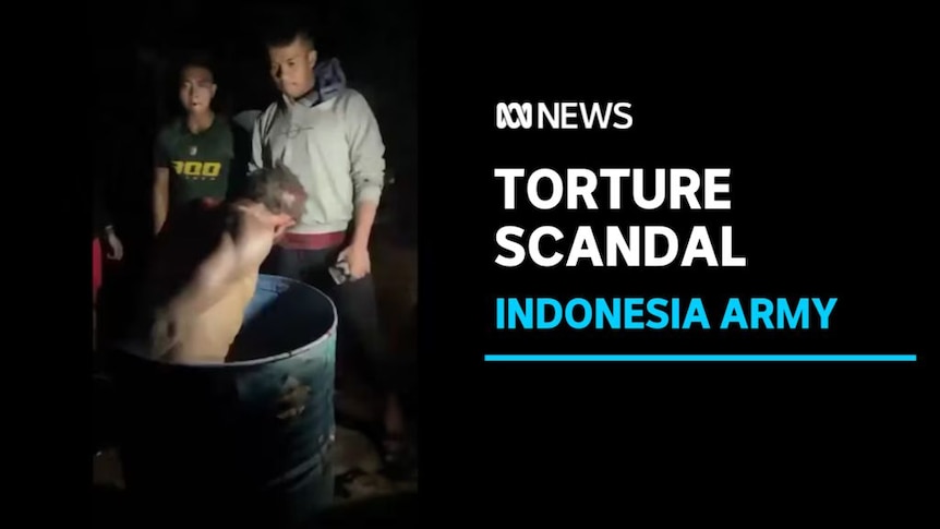 Torture Scandal, Indonesia Army: A naked man in an open barrel while two men watch him.