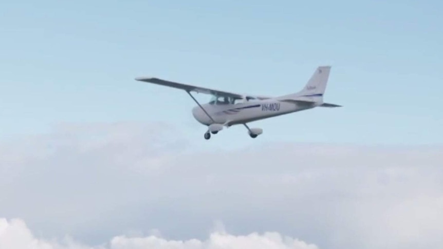 A single-engine plane mid-air.