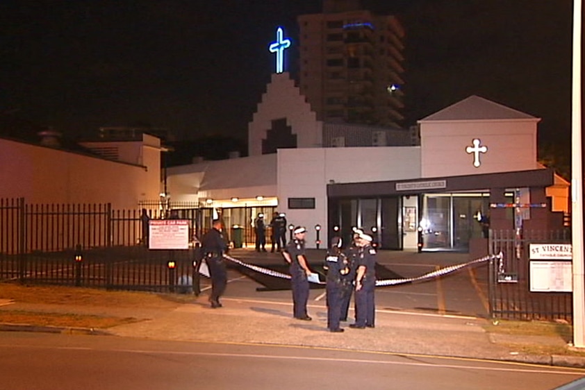 Police outside St Vincent's Catholic Church on the Gold Coast where a man died after falling through a skylight.
