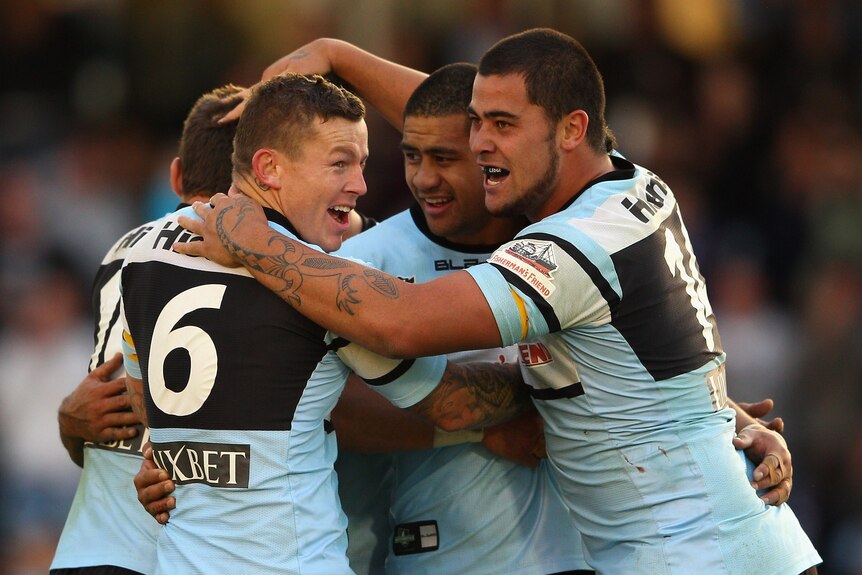 Todd Carney and Sharks team-mates celebrate