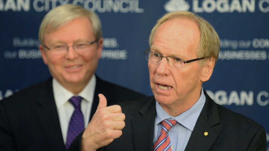Peter Beattie talks at a press conference in Beenleigh alongside Kevin Rudd