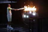 Vanderlei de Lima lights the Olympic flame
