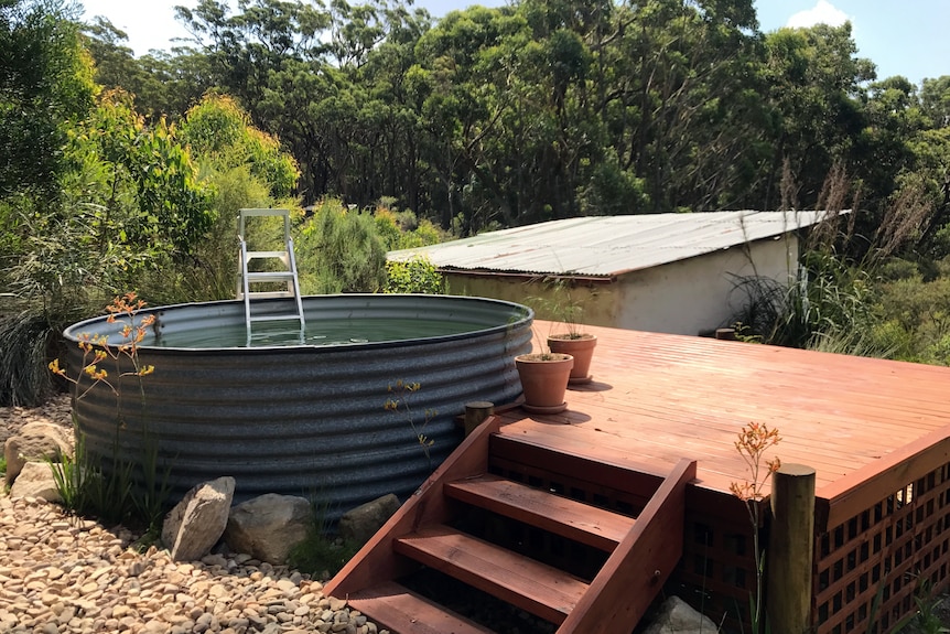 Water tank set up as swimming pool.