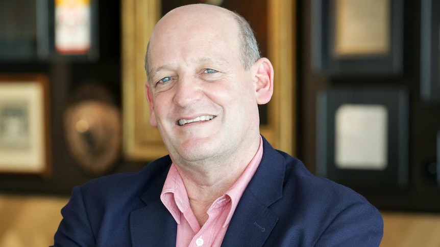 Elders Managing Director Mark Allison in a pale red shirt and blue blazer