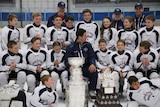 Sidney Crosby (centre) with the NHL Stanley Cup with young players including Queenslander Courtney Mahoney.