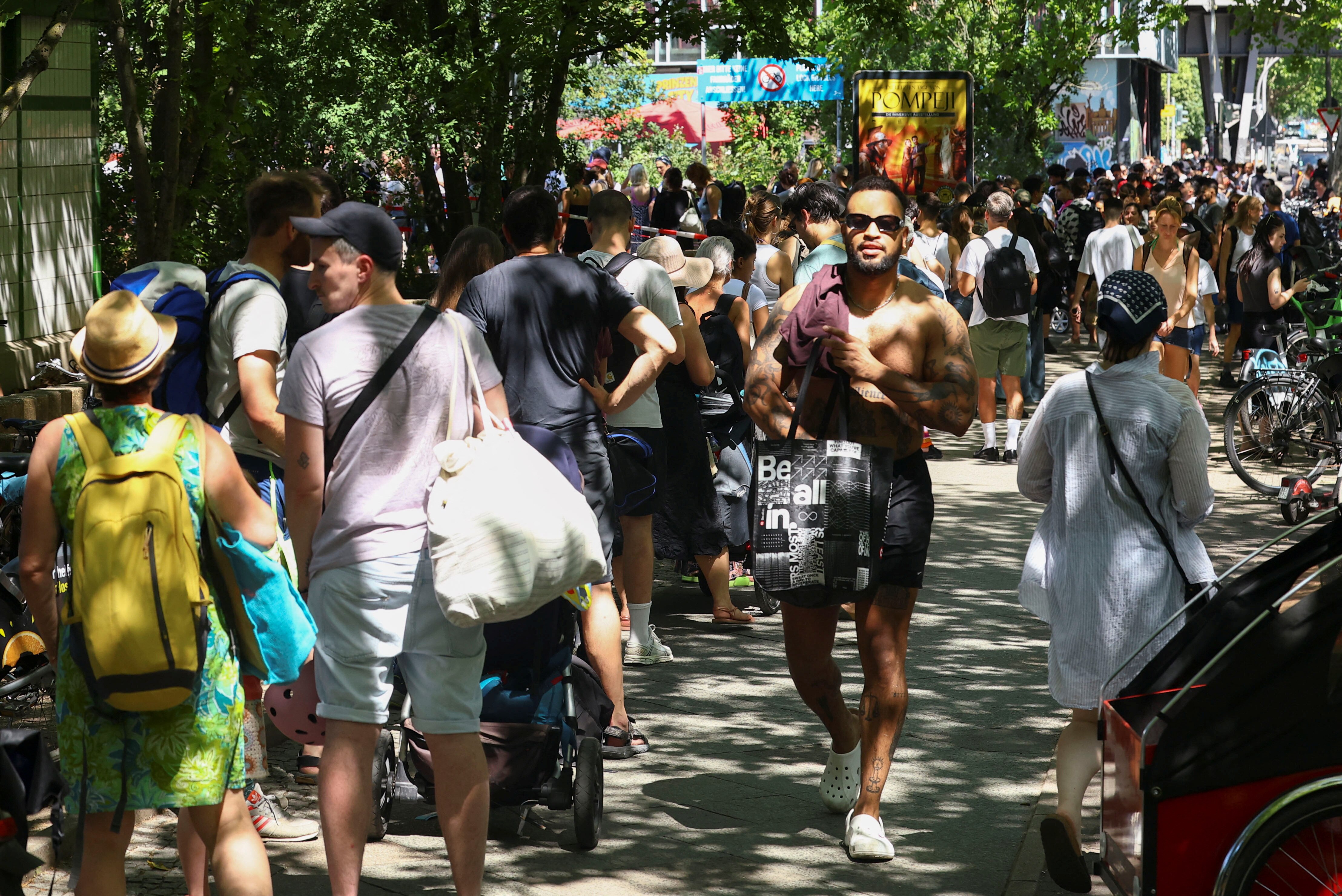 People queue for entry at Prinzenbad public swimming pool in Kreuzberg district during a heatwave in Berlin July 2.