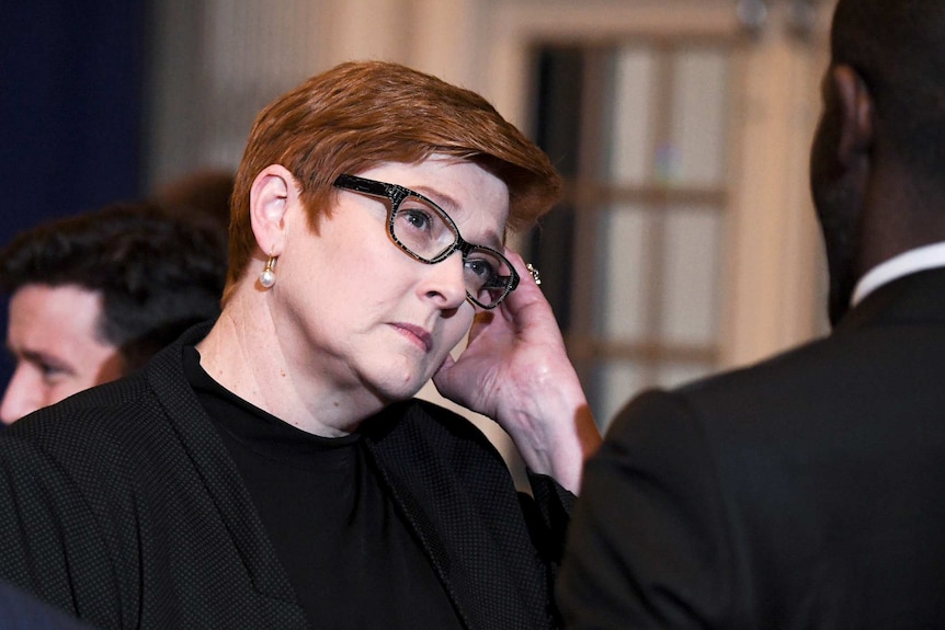 Australian Foreign Minister Marise Payne speaks with somebody during an event.