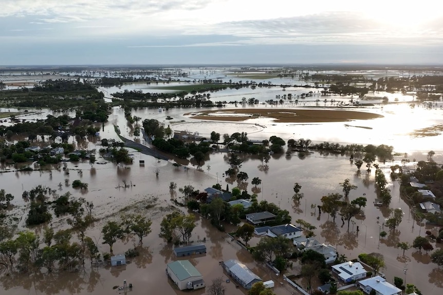 An aerial photo of flooding with homes and trees