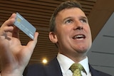 Social Services Assistant Minister Alan Tudge with new welfare card