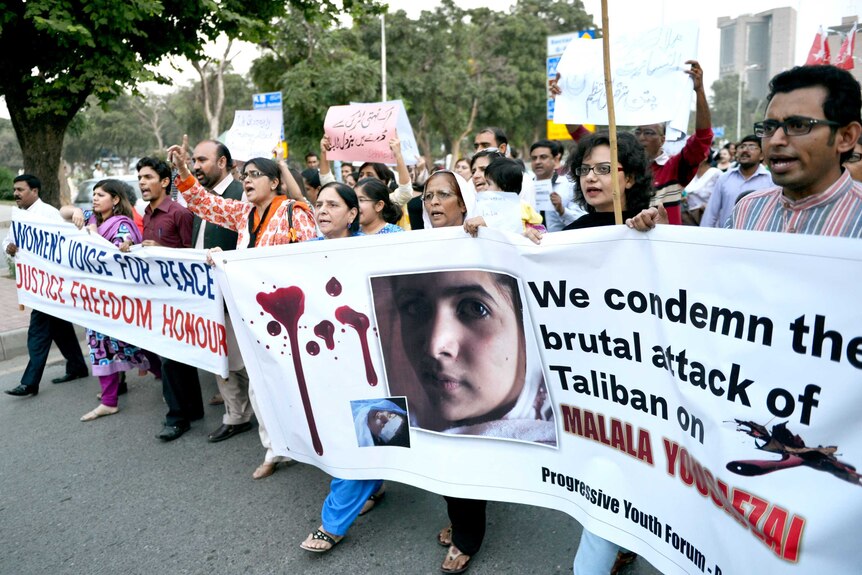 Activists shout anti-Taliban slogans in Islamabad on October 10.