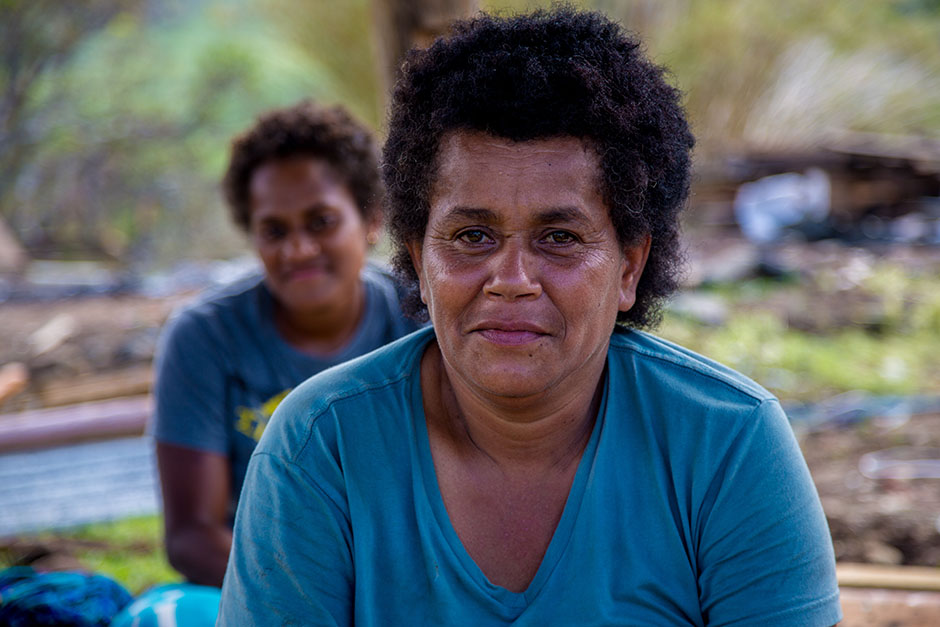 A woman sits in front of the camera after Cyclone Winston