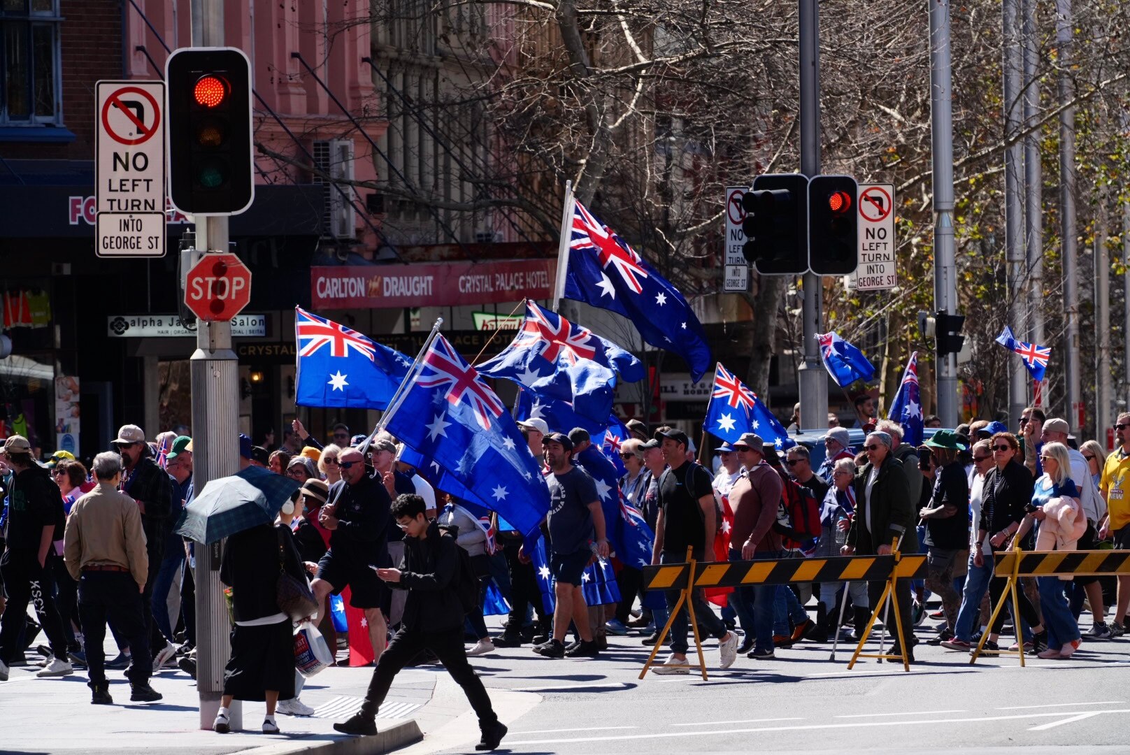 people marching holding australian flags