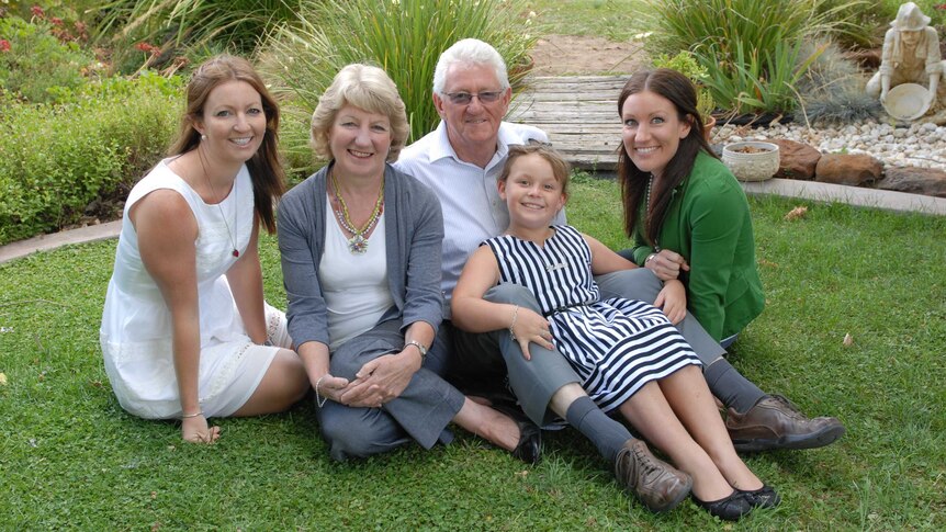 Margaret and John Millington with their two daughters and granddaughter.