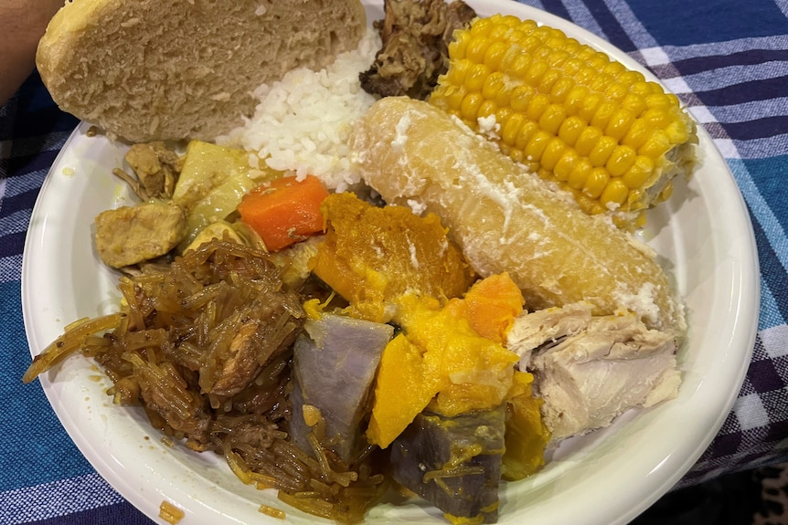 plate of food, corn, meat, rice, damper, potatoes