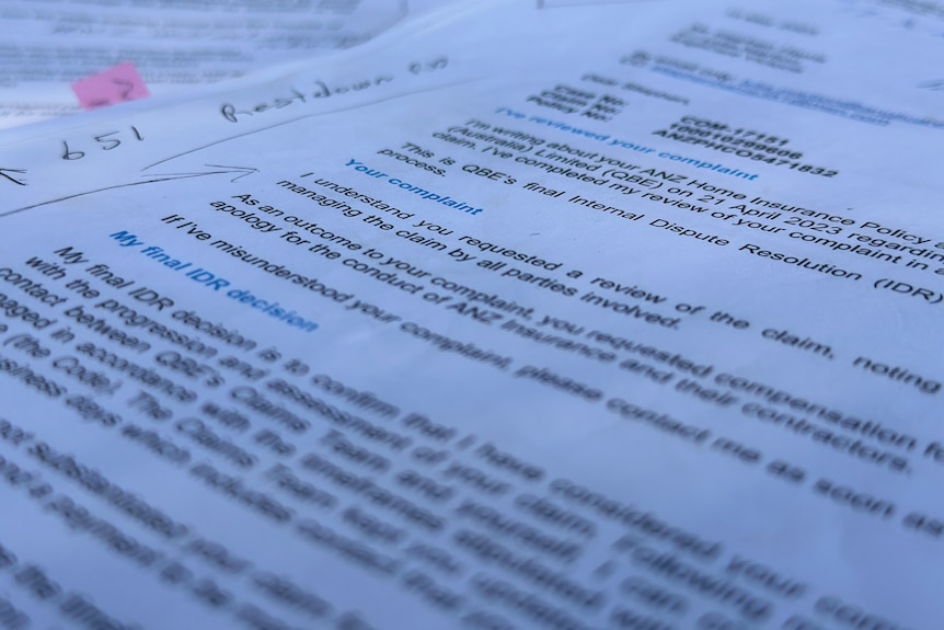 The word "complaint" can be seen in focus on a document.