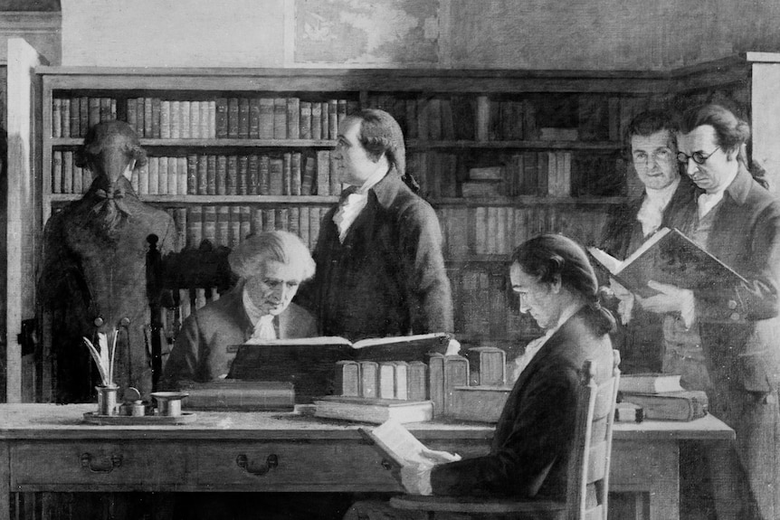 A black and white illustration of people in a 1700s subscription library in the US.