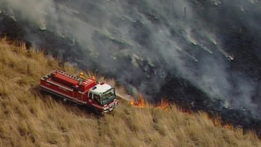 The CFA tackles a grassfire at Mickleham that came within 30 to 40 metres of homes.