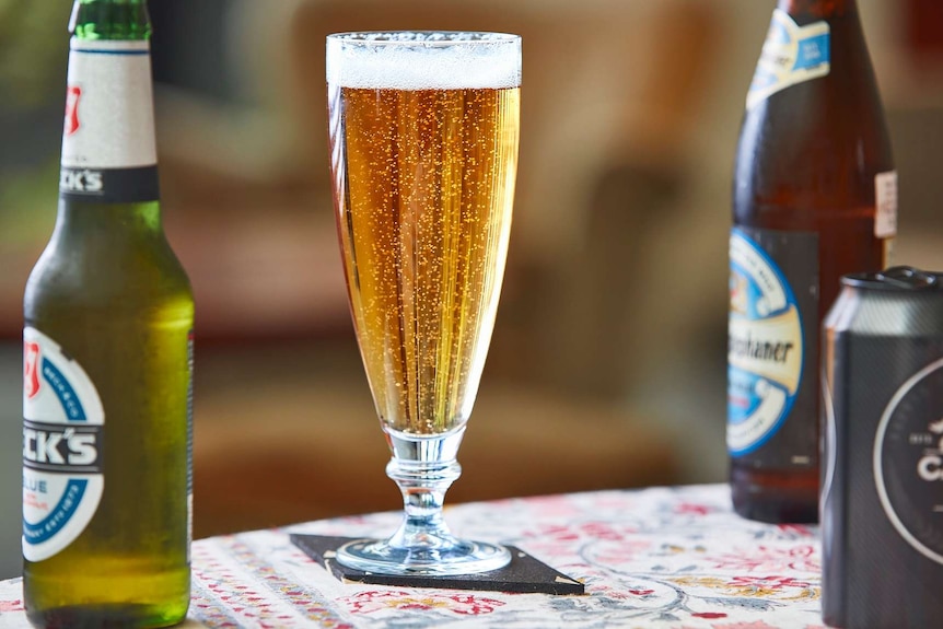 A glass of beer in the sun to depict a collection of low-alcohol cocktail recipes.