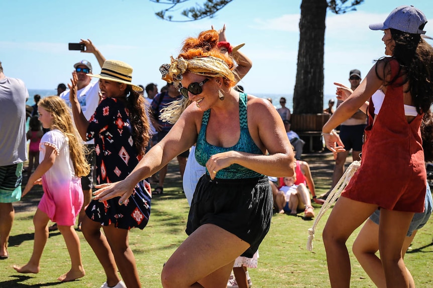 Woman dancing in crowd