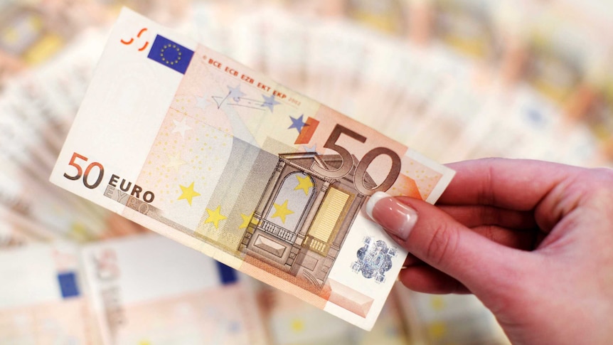Hand holds fifty-euro note