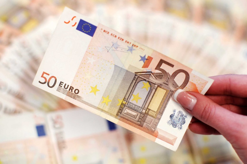 Hand holds fifty-euro note