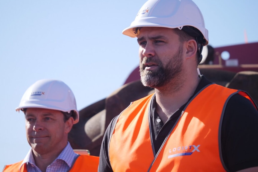 A man in a high visibility vest and hard hat