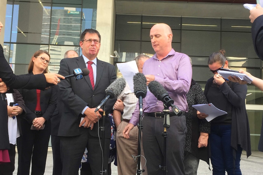 Barbara's nephew Brian Ogden reads a statement from the family outside court, Detective Inspector Mick Dowie stands next to him