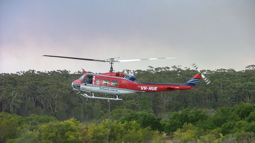 A firefighting chopper fills up at Burrill Lake