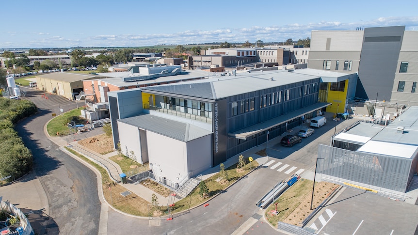 A large building and carpark area