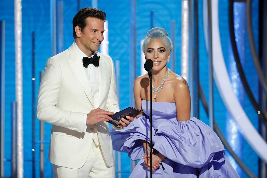 Bradley Cooper and Lady Gaga present an award at the Golden Globes.