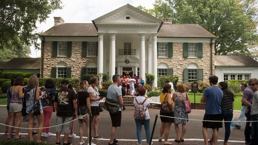 A line of people waiting to get into Graceland